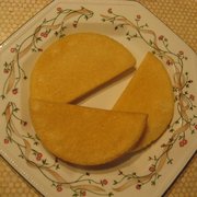 A plate displaying three pieces of Bammies, cut in half-circle shapes